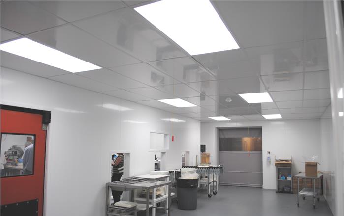 Extrutech Sanitary Glossy White PVC Wall Panels and Ceiling System used in a Food Process Room